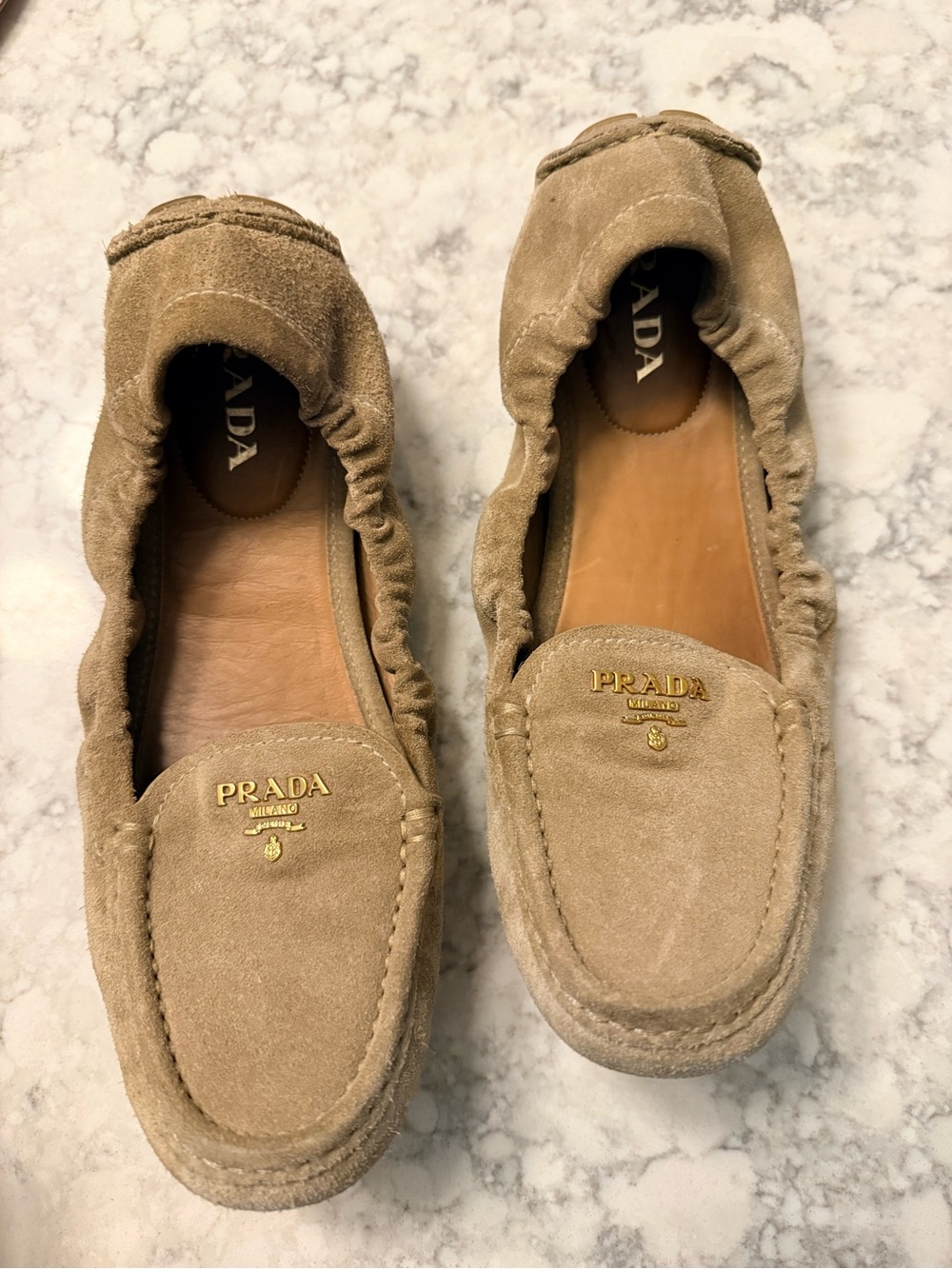 Prada Taupe Suede Slip-On Loafers with Gold Logo